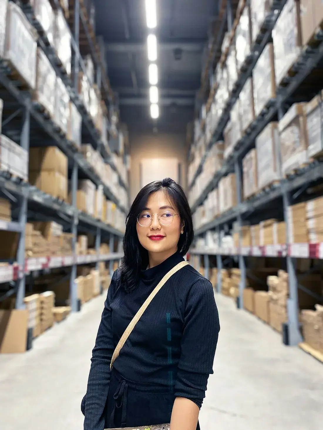 Logistics worker in a high-bay warehouse